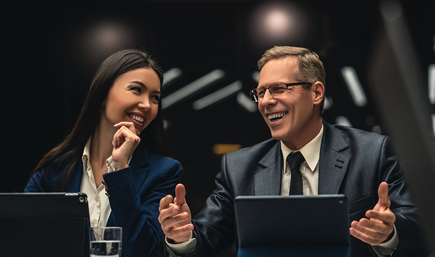 the-smiling-man-and-woman-sitting-at-the-table-on--Q8FVJ9V